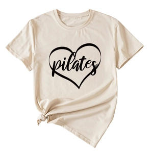 Detail of beige Pilates heart print T-shirt with a stylish front knot on soft fabric