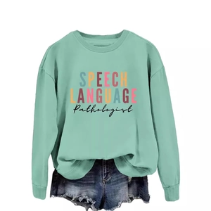 Mint green crewneck sweatshirt with Speech Language Pathologist print and denim shorts