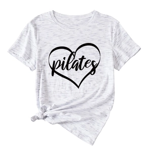 Detail of white melange Pilates T-shirt showing heart print and stylish front hem knot
