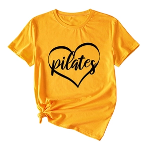 Close-up of heart Pilates print on yellow cotton t-shirt with stylish front knot detail