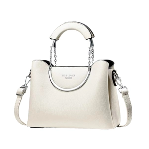 Minimalist cream leather handbag with silver metallic handles and crossbody strap