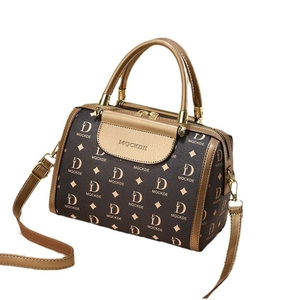 Retro brown printed Boston bag with gold accents and adjustable shoulder strap