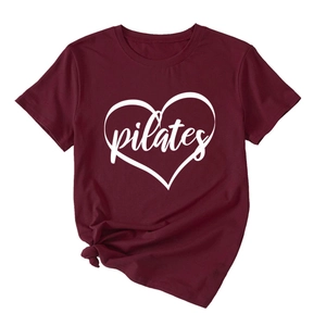 Detail of burgundy Pilates heart print T-shirt with a stylish side knot hem design