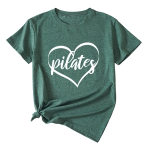 Close-up of Pilates heart print on dark green cotton T-shirt with a stylish front knot detail