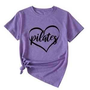 Detail of purple Pilates heart T-shirt featuring a stylish front knot and soft cotton fabric