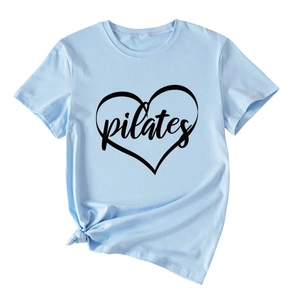 Close-up of light blue Pilates heart print T-shirt with stylish front knot detail