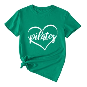 Detail of green Pilates heart print t-shirt with stylish front knot hem design
