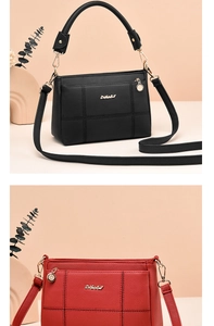 Detail showing litchi texture shoulder bags in black and red with gold ZHGULY logo