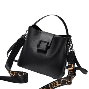 Fashionable black bucket handbag with lychee texture and geometric patterned strap