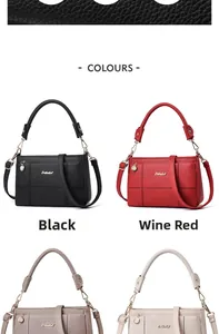Detail of lychee textured leather bags in black and wine red with detachable straps