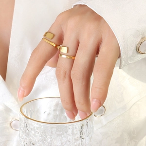 Minimalist double-layered twisted gold ring with a polished mirror finish for women