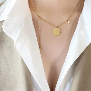 Collier bille en acier titane doré avec pendentif portrait de pièce et étoile