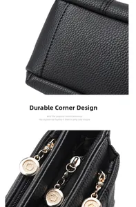 Close-up of durable corner protectors and golden zippers on black lychee leather bag