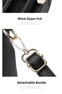 Detail of black lychee grain leather texture with premium golden metal zippers and hardware
