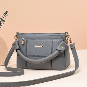 Deep grey litchi grain shoulder bag with golden logo and stitching details