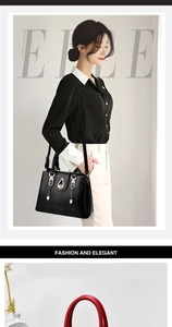 Detail of black pebbled leather tote bag with gold hardware and removable shoulder strap