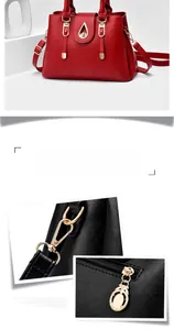 Detail of red pebbled leather handbag featuring golden metal hardware and swivel hooks