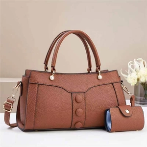 Brown lychee leather tote bag set with pearl buckles and matching mini pouch for women