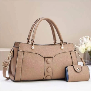 Minimalist beige pebble leather handbag with mini pouch and elegant pearl details
