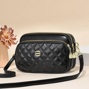 Quilted black PU leather crossbody bag with three zipper compartments and gold hardware
