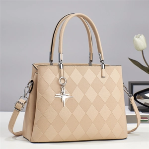 Minimalist beige quilted crossbody bag with dual handles and star charm detail