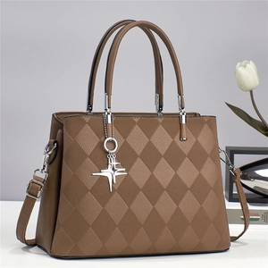 Deep brown quilted crossbody bag with silver star charm and elegant top handles