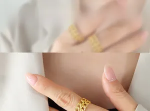 Detail shot of a dual-layer gold cuban chain ring for women on index finger