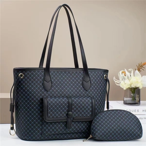Blue geometric tote bag set with black leather trim and matching interior pouch