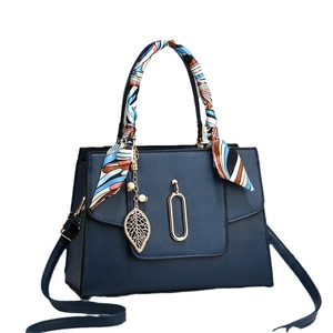 Navy blue PU leather tote bag with lychee texture, silk scarf handle, and leaf pendant