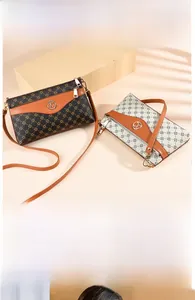 Detailed macro view of monogram print shoulder bag with gold-tone K logo hardware