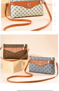 Detailed close-up of textured monogram PVC bags with premium metallic K logo and faux leather trim