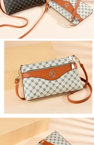 Detail view of vintage printed tote bag with leather trim and golden K-logo hardware