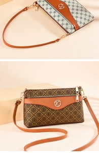 Detail of vintage printed tote bag with metal K logo and brown leather strap accents