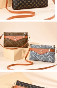 Detailed view of women's vintage printed tote bags with gold hardware and logo charm