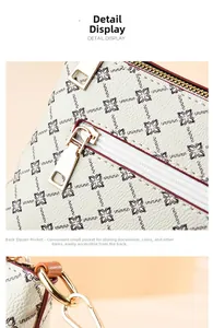 Detail of vintage pattern tote bag featuring smooth zipper and lychee textured leather