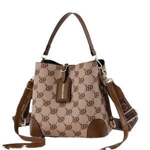 Retro monogram bucket bag in beige canvas and brown leather with wide shoulder strap