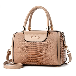 Elegant beige faux crocodile leather handbag with golden hardware and top handles