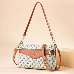 Retro geometric print canvas tote bag with brown leather straps and gold metal K logo