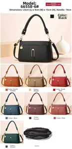 Detailed view of lychee pattern shoulder bag showing internal compartments and 23cm dimensions
