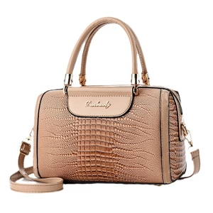 Elegant beige crocodile embossed Boston handbag with gold hardware and shoulder strap