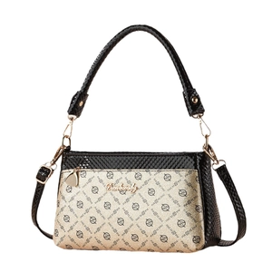Fashionable black snake-textured shoulder bag with gold logo print and metal nameplate