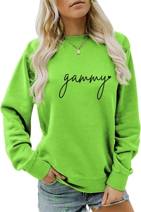 Detail of neon green crewneck sweatshirt with black gammy lettering and heart print