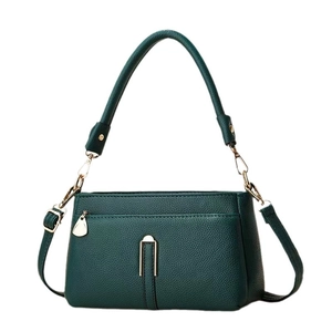 Dark green lychee texture underarm bag with gold metal hardware and adjustable shoulder strap