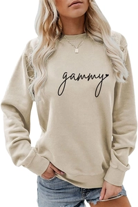 Detail of gammy script print and heart motif on beige long sleeve crewneck sweatshirt