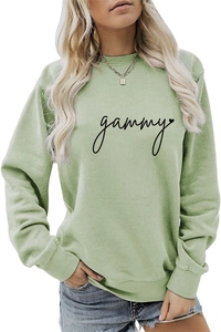 Detail of sage green crewneck sweatshirt featuring black gammy script and heart print