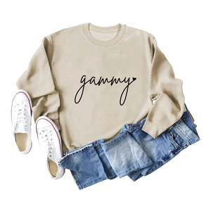 Light beige crewneck sweatshirt with gammy script print and heart detail in a flat lay