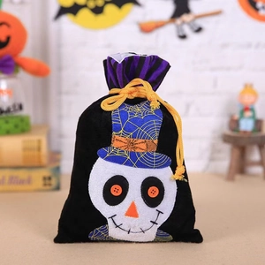 Detail of velvet Halloween drawstring candy bag featuring skull and spider web hat