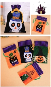 Detail of Halloween drawstring gift bags with velvet fabric and plush applique designs
