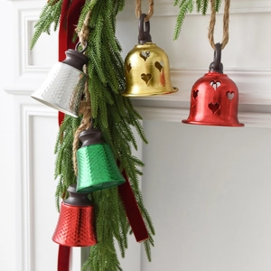 Five assorted Christmas iron bells with heart cutouts and rustic hemp hanging cords