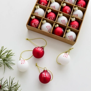 Christmas glass ball set with Merry Joy prints and gold strings in a craft paper box